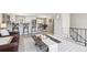 Open-concept layout featuring kitchen, dining and living space for seamless entertaining at 13051 W Jewell Cir, Lakewood, CO 80228