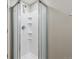Shower features a modern fixture and built-in shelving within a glass-enclosed space at 13051 W Jewell Cir, Lakewood, CO 80228