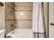 Basement bathroom with shower/tub and tile surround at 3720 S Hazel Ct, Englewood, CO 80110