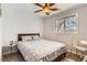 Cozy bedroom with a double bed, ceiling fan, and ample natural light at 3720 S Hazel Ct, Englewood, CO 80110