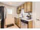 Modern kitchen with stainless steel appliances and white quartz countertops at 3720 S Hazel Ct, Englewood, CO 80110