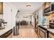 Modern kitchen features stainless steel appliances and tile flooring at 3720 S Hazel Ct, Englewood, CO 80110