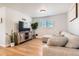 Bright living room with sectional sofa and wood flooring at 3720 S Hazel Ct, Englewood, CO 80110