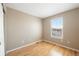 The bedroom offers a hardwood floor and a window with a bright, natural view at 658 Casper Dr, Lafayette, CO 80026