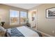 This bedroom features dual windows for natural light and a view of the residential community at 658 Casper Dr, Lafayette, CO 80026