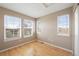 This room has a hardwood floor and three large windows for plenty of natural light at 658 Casper Dr, Lafayette, CO 80026