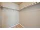 The closet offers ample storage space with built-in shelving and a hardwood floor at 658 Casper Dr, Lafayette, CO 80026