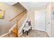Welcoming entryway with staircase, bench, and stylish decor, providing a cozy first impression at 658 Casper Dr, Lafayette, CO 80026