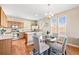 Eat-in kitchen with stainless steel appliances, hardwood floors, and natural light at 658 Casper Dr, Lafayette, CO 80026