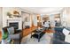 Cozy living room with fireplace, hardwood floors, and open layout to the kitchen at 658 Casper Dr, Lafayette, CO 80026