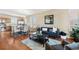 Comfortable living space with hardwood floors, kitchen view, and stylish decor at 658 Casper Dr, Lafayette, CO 80026