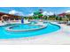 Community pool with a winding lazy river and a green and blue winding slide at 658 Casper Dr, Lafayette, CO 80026