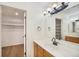 Bathroom featuring ample storage in vanity, white countertop, and bright lighting at 2120 Gross Dam Rd, Golden, CO 80403