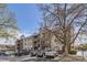 Apartment complex with lush trees, and parking at 10785 W 63Rd Pl # 202, Arvada, CO 80004