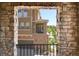 Balcony view framed by brick arches, showcasing the neighborhood at 3437 Rosato Dr # C, Highlands Ranch, CO 80126