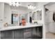 Double vanity bathroom with granite countertops, stylish fixtures, and a view to a walk-in closet at 3437 Rosato Dr # C, Highlands Ranch, CO 80126