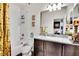 Well-lit bathroom features a granite countertop vanity, decorative accents, and a shower-tub combination at 3437 Rosato Dr # C, Highlands Ranch, CO 80126