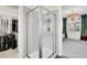 Modern bathroom with glass shower enclosure and view into a bedroom, creating an open, luxurious feel at 3437 Rosato Dr # C, Highlands Ranch, CO 80126