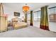 Elegant bedroom featuring a chandelier, plush carpet, and large windows with decorative drapes at 3437 Rosato Dr # C, Highlands Ranch, CO 80126