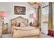 Luxurious bedroom with a chandelier, plush carpet, and a window with stylish drapes at 3437 Rosato Dr # C, Highlands Ranch, CO 80126