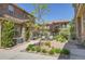 Charming courtyard featuring manicured landscaping, seating, and architectural stone details, offering a serene outdoor space at 3437 Rosato Dr # C, Highlands Ranch, CO 80126