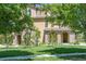 Inviting view of a multi-story home with stone accents and lush greenery at 3437 Rosato Dr # C, Highlands Ranch, CO 80126