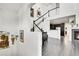 Bright foyer showcasing the staircase, living area, and hardwood floors at 3437 Rosato Dr # C, Highlands Ranch, CO 80126