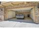 Well-lit garage featuring a car, ample space, and a convenient door for easy access at 3437 Rosato Dr # C, Highlands Ranch, CO 80126