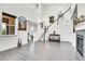 Spacious living room featuring tall ceilings, lots of natural light, and wood floors at 3437 Rosato Dr # C, Highlands Ranch, CO 80126