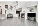 Inviting living room featuring a fireplace, staircase, and hardwood floors at 3437 Rosato Dr # C, Highlands Ranch, CO 80126