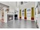 Bright living room features a fireplace, large windows, and hardwood floors at 3437 Rosato Dr # C, Highlands Ranch, CO 80126