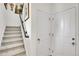Carpeted staircase with a dark wood handrail leading to the upper level at 3437 Rosato Dr # C, Highlands Ranch, CO 80126