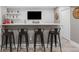 Finished basement bar area with white bar top, TV and comfortable bar stool seating at 18233 E Dorado Ave, Centennial, CO 80015