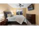 Bedroom featuring a ceiling fan, warm tones, and comfortable furniture at 18233 E Dorado Ave, Centennial, CO 80015