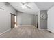 Spacious bedroom featuring a ceiling fan, neutral tones, and plush carpet at 18233 E Dorado Ave, Centennial, CO 80015