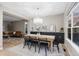 Charming dining room featuring a contemporary chandelier and views into the living room at 18233 E Dorado Ave, Centennial, CO 80015