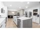 Bright kitchen with white cabinetry, stainless steel appliances, and an island with seating at 18233 E Dorado Ave, Centennial, CO 80015