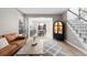 Inviting living room showcasing staircase, neutral walls, light wood floors, and black accents at 18233 E Dorado Ave, Centennial, CO 80015