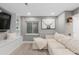 Cozy living room features a large sofa, built-in shelving, and a modern design with a rustic touch at 18233 E Dorado Ave, Centennial, CO 80015