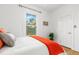 Comfortable bedroom featuring bright décor, a large window, and hardwood floors for an inviting atmosphere at 4841 Alcott St, Denver, CO 80221