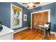 Cozy bedroom featuring beautiful hardwood floors, a large window, and a spacious closet at 4841 Alcott St, Denver, CO 80221