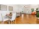 Inviting dining room with hardwood floors, stylish furniture, and ample natural light perfect for gatherings at 4841 Alcott St, Denver, CO 80221