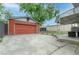 View of detached one car garage and attached carport at 4841 Alcott St, Denver, CO 80221