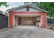An open garage with brickwork and a wall-mounted workbench at 4841 Alcott St, Denver, CO 80221