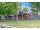 Charming single-story home featuring well-maintained landscaping and a cozy front porch at 4841 Alcott St, Denver, CO 80221
