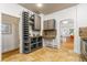 Stylish kitchen featuring gray cabinetry, wine storage, tiled floor, and an inviting eat-in area at 4841 Alcott St, Denver, CO 80221