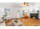 Spacious living room featuring hardwood floors, a cozy fireplace, and ample seating at 4841 Alcott St, Denver, CO 80221