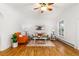 Inviting living room with hardwood floors, modern decor, and ample natural light at 4841 Alcott St, Denver, CO 80221