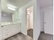 Bathroom with white cabinets, quartz countertops and a glass door shower at 3833 S Bahama St, Aurora, CO 80013