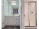 Bathroom featuring white shower and cabinets at 3833 S Bahama St, Aurora, CO 80013